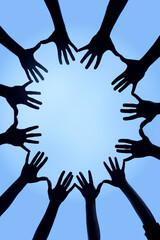 Poster - Uniting together. Cropped shot of a group of hands spread out together in a circle.