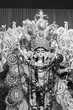 Black and white beautiful face of Goddess Durga idol with her full glory, Durga Puja festival at night. Shot under colored light at Howrah, West Bengal, India.