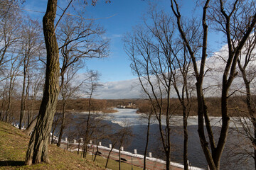 Wall Mural - Sozh river embankment in winter. Ice drift. Early spring in Gomel. Gomel palace and park ensemble. View of the embankment from the pedestrian bridge over the Sozh River. Gomel. Belarus