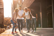 © BalanceFormCreative - Young friends hang out on the city street.They go for walks together and have fun in the city downtown.