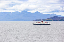 The MV Loch Fyne CalMac Ferry Heading Towards Mallaig From The Isle Of Skye, Highland, Scotland UK - The Isle Of Rum Is In The Background.