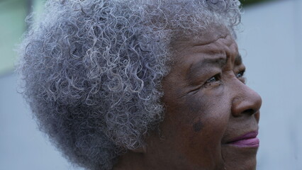 Poster - A meditative senior woman portrait face closeup in contemplation