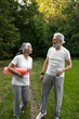 © Milana - Beautiful senior couple is practicing yoga in the nature