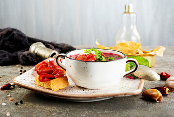 Canvas Print - Traditional Ukrainian Russian borscht . Bowl of red beet root soup borsch with white cream . Beet Root delicious soup . Traditional Ukraine food cuisine