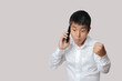 © nuruddean - Businessman talking smartphone with winner gesture and celebrating victory happy.