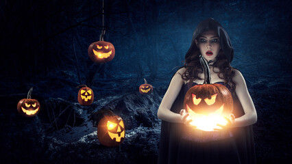 Wall Mural - beautiful young woman in witches hat and costume