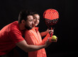 © FotoAndalucia - man teaching girl to play paddle tennis