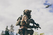 © .shock - War concept. A bearded soldier in a special forces uniform fighting an enemy in a forest area. Selective focus