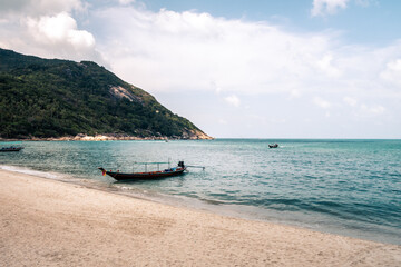 Wall Mural - thai traditional wooden boat and beautiful sand beach. koh phangan, thailand.