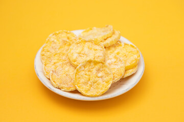 Sticker - small mini crispy corn diet toasts on white dish