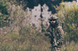 © .shock - A bearded soldier in uniform of special forces in a dangerous military action in a dangerous enemy area. Selective focus