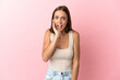 © luismolinero - Young woman over isolated pink background with surprise and shocked facial expression