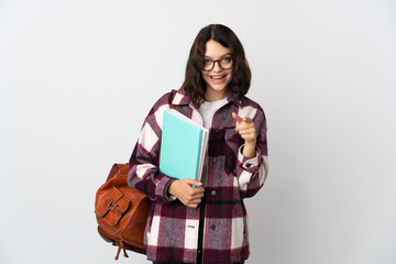 Wall Mural - Teenager Ukrainian student isolated on white background surprised and pointing front