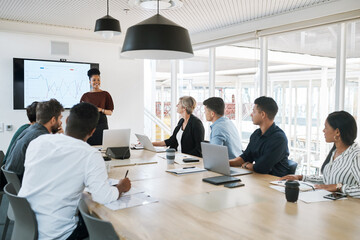 Poster - This is our financial state of affairs. Shot of a group of businesspeople having a meeting in a modern office.