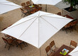 guest garden with white sun umbrellas