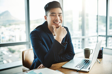 Poster - More than a job, its a career. Portrait of a happy young businessman working at his desk in a modern office.