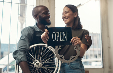 Aufkleber - Your bike is in good hands here. Shot of a young couple standing together in their bicycle shop and holding an open sign.
