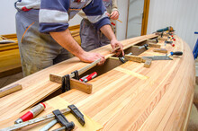 Carpenters Making Wooden Boat In Carpenter Workshop