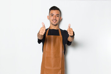 Handsome apron man smiling happy with ok sign gesture tumb up isolated on white background
