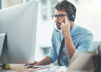 Aufkleber - Trust him to find the answer. Shot of a young man working in a call center.