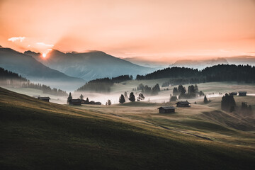 Sticker - Landscape view of the Dolomites mountains under a cloudy sky during the sunset