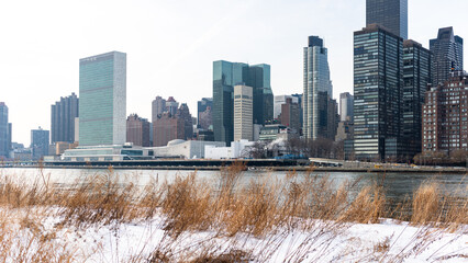 Poster - Beautiful view of tall buildings by the sea in Manhattan, New York City