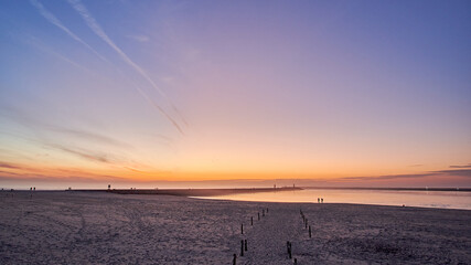 Poster - Scenic view of the sandy Barra beach at pink sunset in Aveiro, Portugal