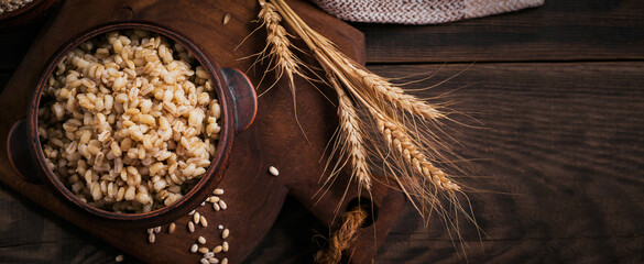 Bowl of cooked peeled barley grains porridge