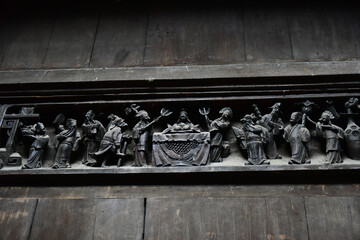 Wall Mural - Carved metal fresco with Asian monks and the chief monk in the middle