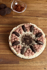 Wall Mural - Top view of a delicious homemade cheesecake with cookies