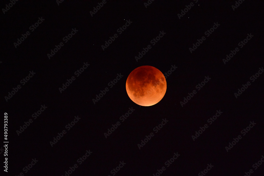 Super full blood moon with total lunar eclipse on dark sky Stock Photo ...