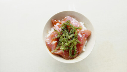 Poster - Closeup shot of appetizing rice served with fish and seaweed in the white bowl