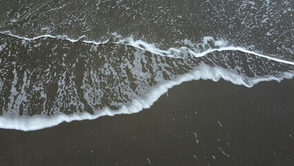 Poster - Aeiral view of a sand beach with ocean waves