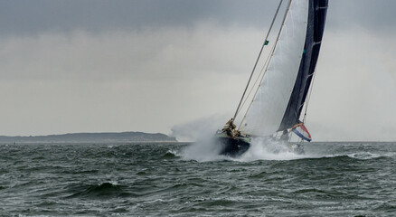 Canvas Print - View of the sailboat in the sea against the sky.