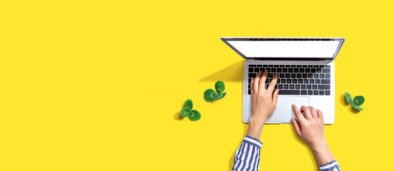 Wall Mural - Laptop computer with shamrock leaves - flat lay
