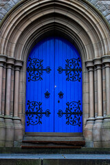 Poster - Vertical shot of an old blue church door