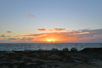 Canvas Print - Landscape view of the dramatic sky on the beach at sunset