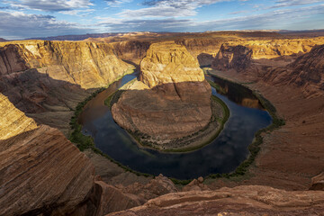 Poster - Horseshoe Bend and the Colorado River against a cloudy sky in Arizona, USA