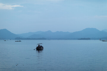 Wall Mural - amazing view of small boats in the sea on cloudy day