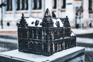 Poster - Closeup of a castle sculpture covered with snow