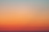 Fototapeta Zachód słońca - Tranquil background of red and orange gradient sky