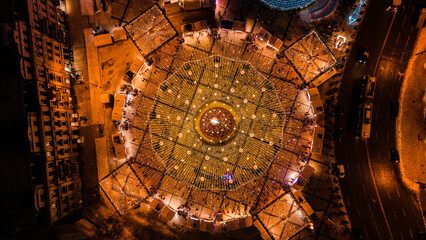 Wall Mural - Aerial view of a cityscape at night with lights