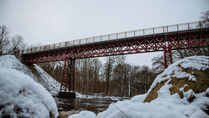 Sticker - Iron bridge over a creek in the winter wood