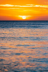 Wall Mural - captivating vertical photo of the sea at sunset