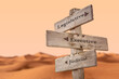 legislative executive judicial text quote on wooden signpost outdoors in dry desert sand dune scenery.