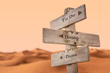 To Do Doing Done Text Quote On Wooden Signpost Outdoors In Dry Desert Sand Dune Scenery.