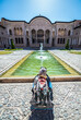 Tourist on courtyard of historic house of Tabatabaei family in old part of Kashan