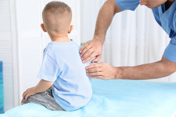 Sticker - Orthopedist examining child's back in clinic, closeup. Scoliosis treatment