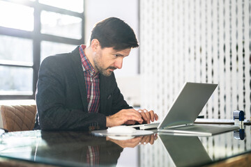 Poster - Man Sitting In Bad Posture Working On Computer