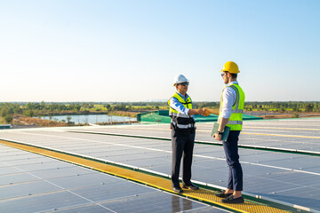 Wall Mural - professional engineer using drone and digital tablet maintaining solar cell panels together on build